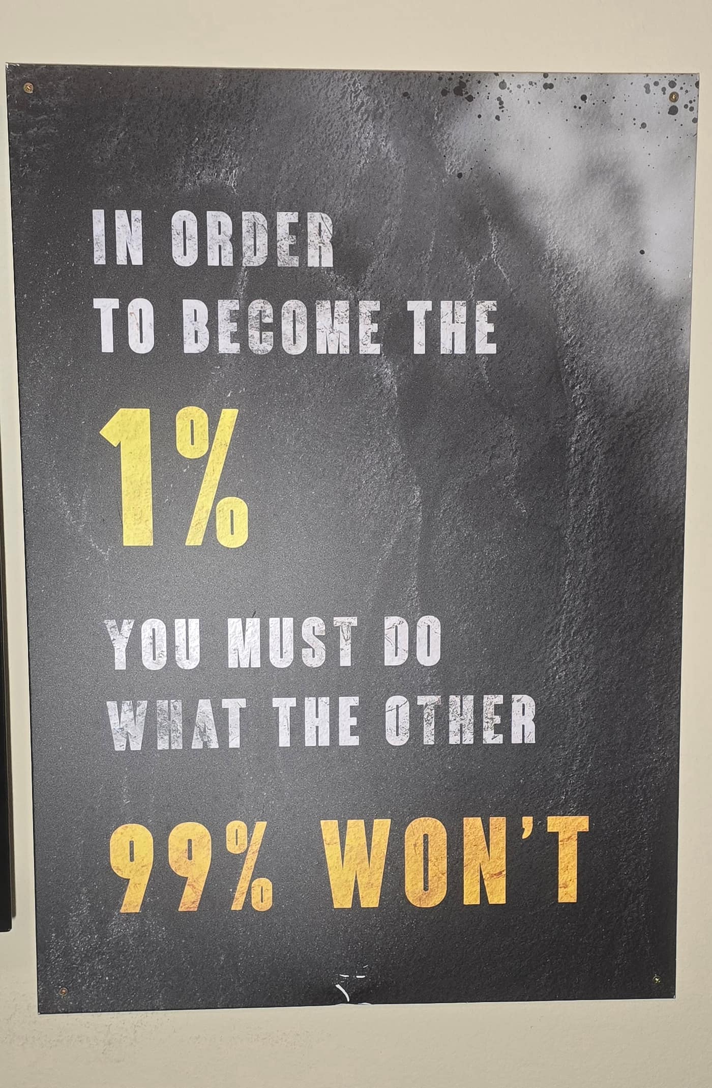 "Become the 1%" wall sign